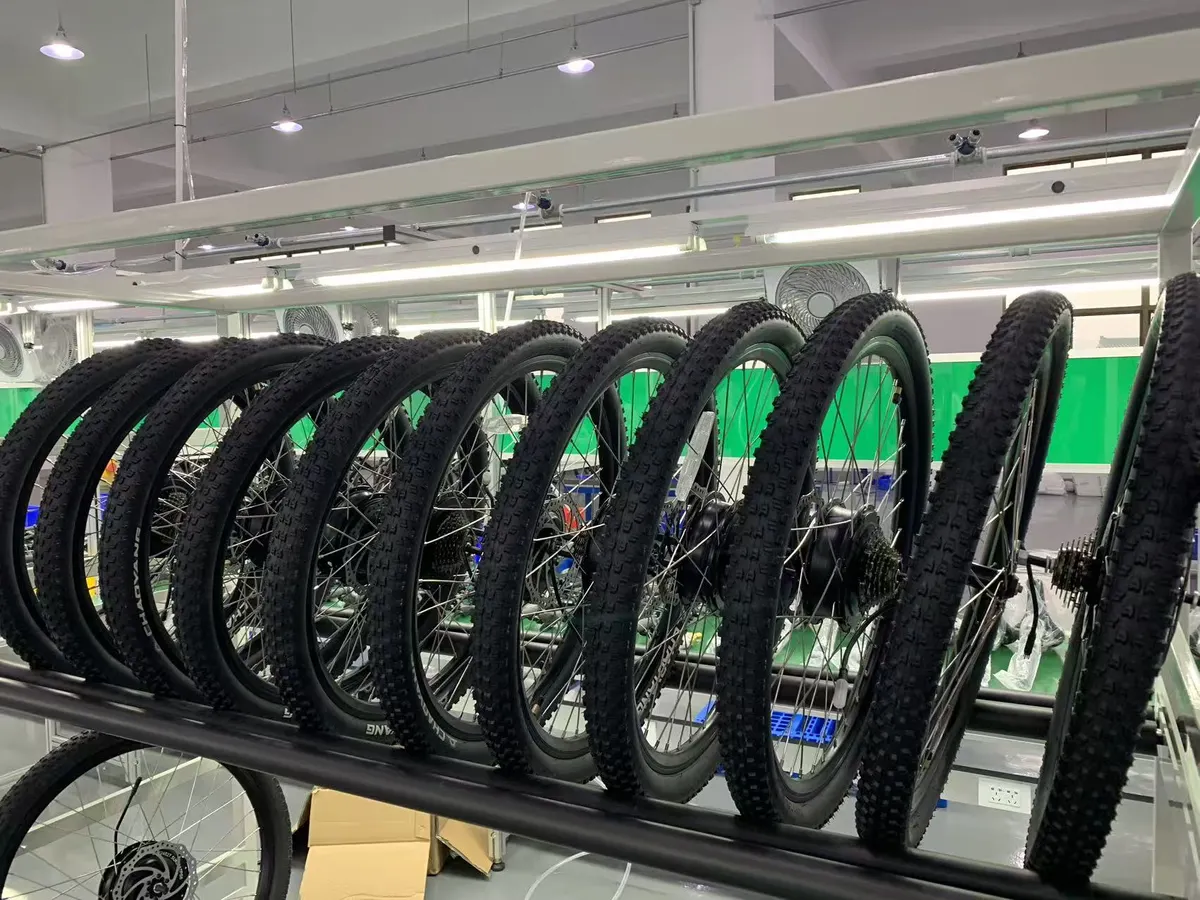 Built wheels with hub motors racked beside the line