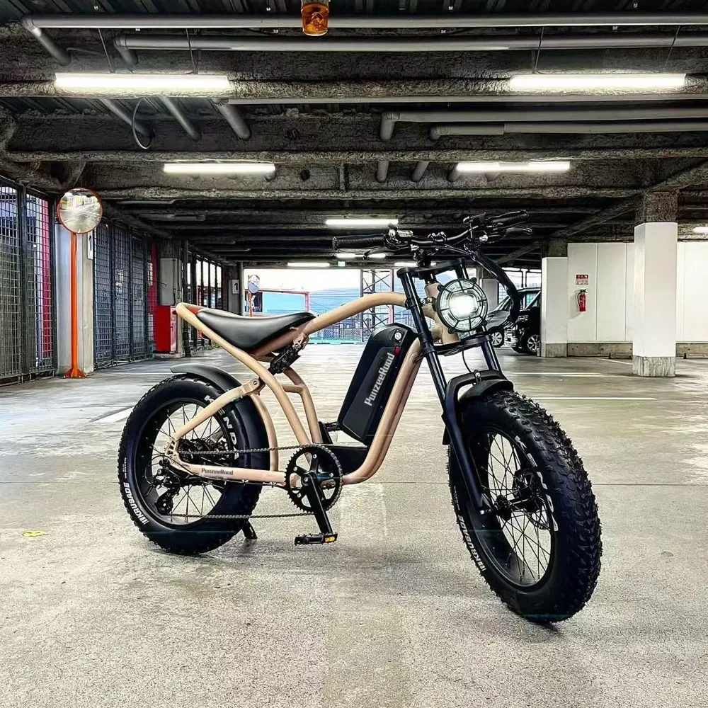 PanzeeRoad 20-inch moto-style e-bike in tan and black, parked in a garage